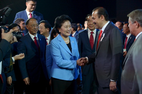 Chinese Vice Premier Liu Yandong shakes hands with Kazakhstan's Prime Minister Karim Massimov after Beijing was elected to host the 2022 Olympic Winter Games at IOC meeting in Kuala Lumpur
