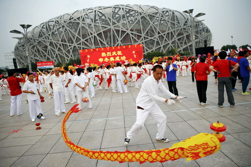 People celebrate after Beijing was chosen to host the 2022 Winter Olympics at the Bird's Nest Olympic stadium in Beijing